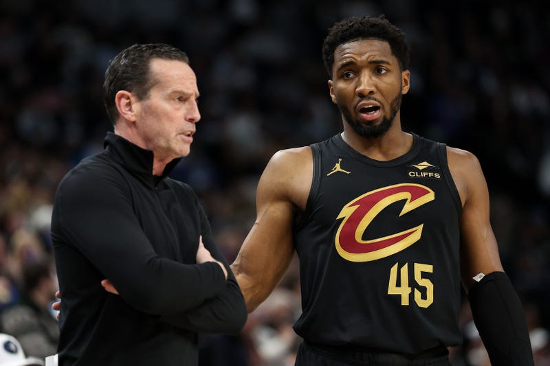 Cleveland Cavaliers guard Donovan Mitchell (45) talks with head coach Kenny Atkinson 