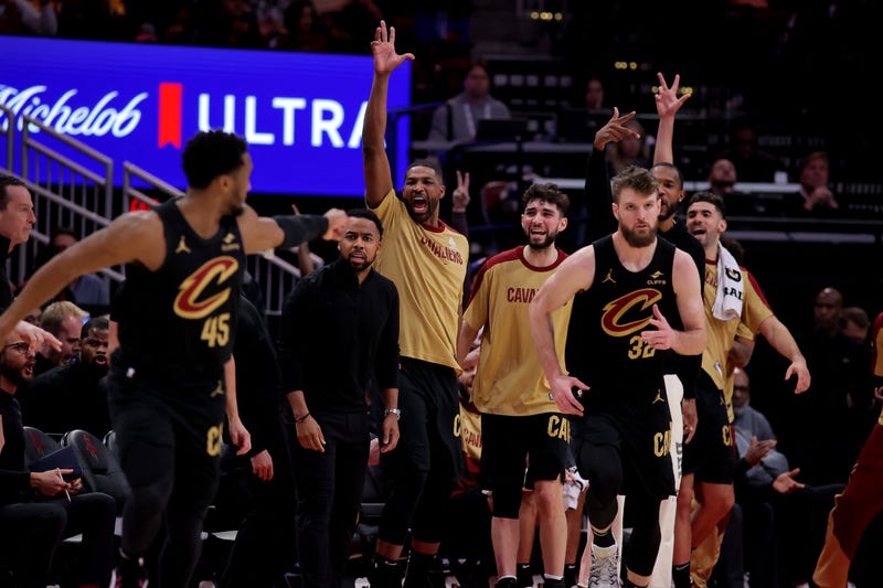 Jan 22, 2025; Houston, Texas, USA; Cleveland Cavaliers bench players react after a made basket by Cleveland Cavaliers forward Dean Wade (32) against the Houston Rockets during the fourth quarter at Toyota Center.