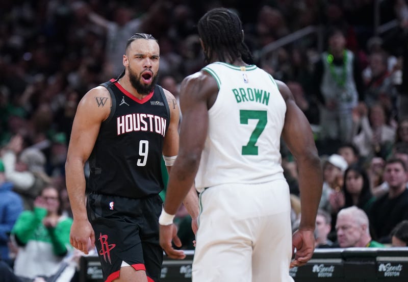 Houston Rockets forward Dillon Brooks (9) reacts after Boston Celtics guard Jaylen Brown (7) makes a three point basket in the second half at TD Garden.