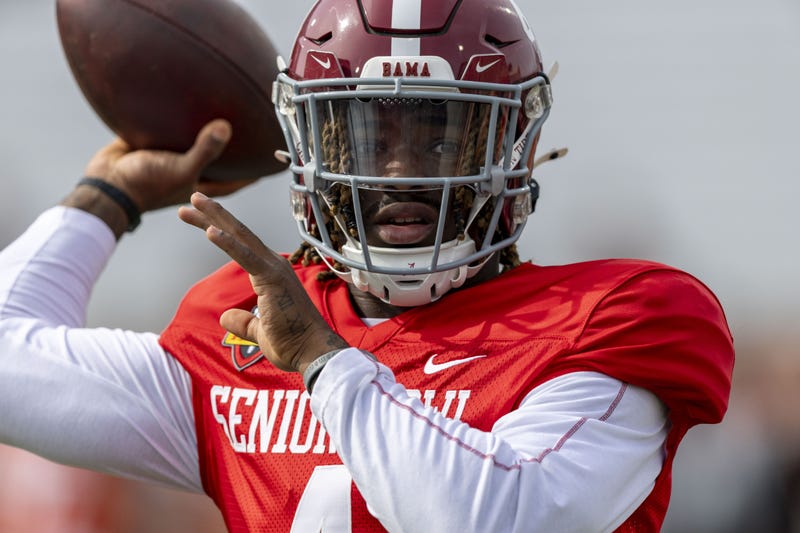 Jan 28, 2025; Mobile, AL, USA; American team quarterback Jalen Milroe of Alabama (4) throws the ball during Senior Bowl practice for the American team at Hancock Whitney Stadium.