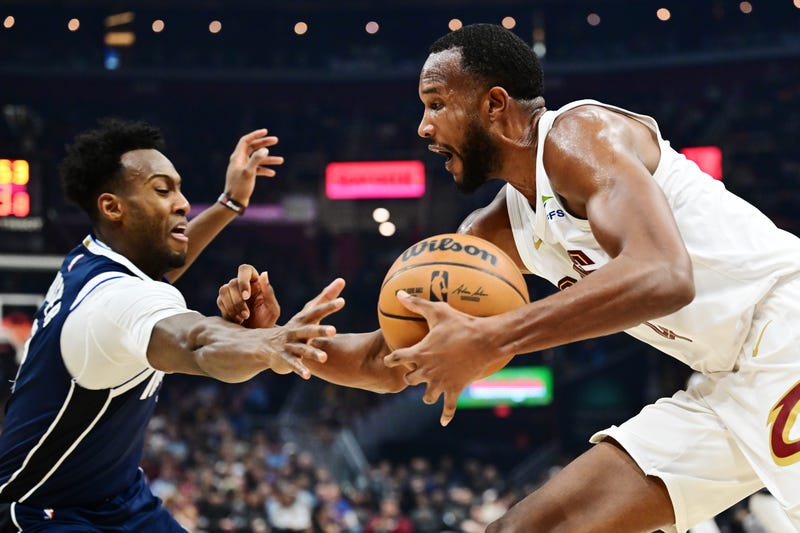 Dallas Mavericks forward Olivier-Maxence Prosper (8) defends against Cleveland Cavaliers forward Evan Mobley (4) during the first half at Rocket Mortgage FieldHouse.