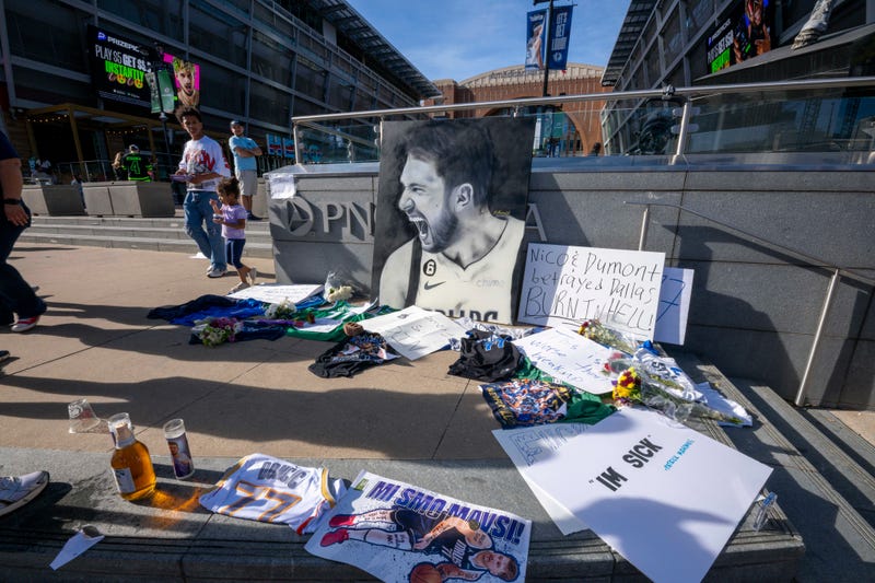 Dallas Mavericks fans leave notes and memorabilia before the game between the Dallas Stars and the Columbus Blue Jackets at American Airlines Center to protest the trade of Mavericks point guard Luka Doncic to the Los Angeles Lakers.