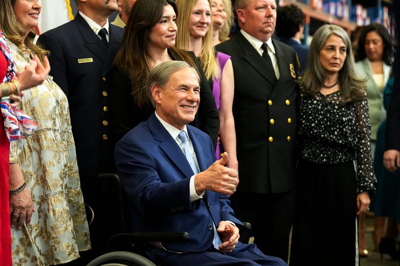 Texas Governor Greg Abbott takes photos with spectators after the State of the State address at Arnold Oil Company on Sunday, February. 2, 2025.