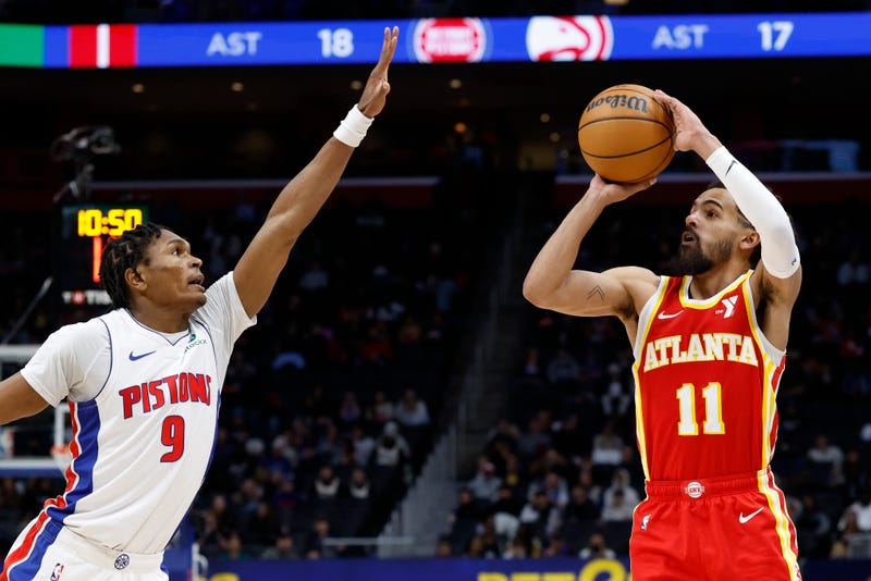 Feb 3, 2025; Detroit, Michigan, USA; Atlanta Hawks guard Trae Young (11) shoots on Detroit Pistons forward Ausar Thompson (9) in the second half at Little Caesars Arena. Mandatory Credit: Rick Osentoski-Imagn Images