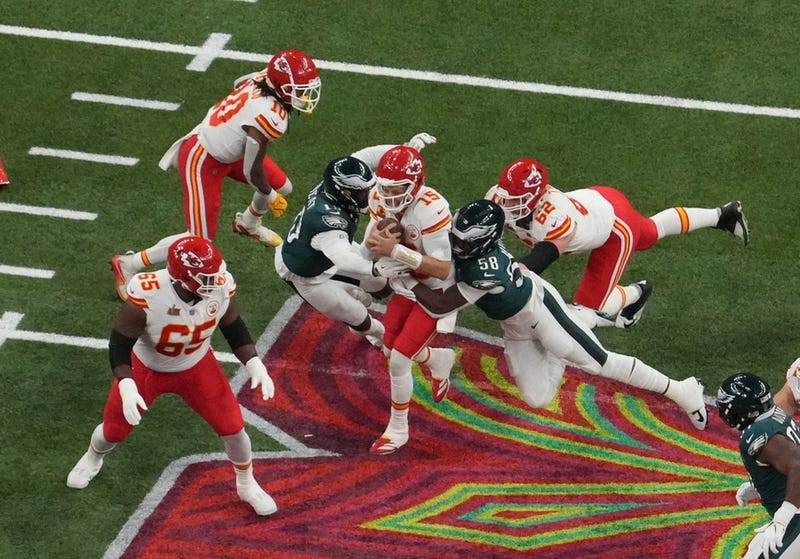 Feb 9, 2025; New Orleans, LA, USA; Kansas City Chiefs quarterback Patrick Mahomes (15) is pressured by Philadelphia Eagles linebacker Josh Sweat (19) and Philadelphia Eagles linebacker Jalyx Hunt (58) in the second quarter during Super Bowl LIX at Caesars Superdome. Mandatory Credit: James Lang-Imagn Images