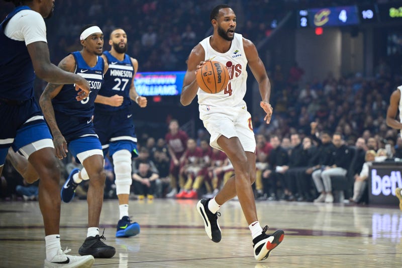 Cleveland Cavaliers forward Evan Mobley (4) brings the ball up court in the first quarter against the Minnesota Timberwolves at Rocket Mortgage FieldHouse
