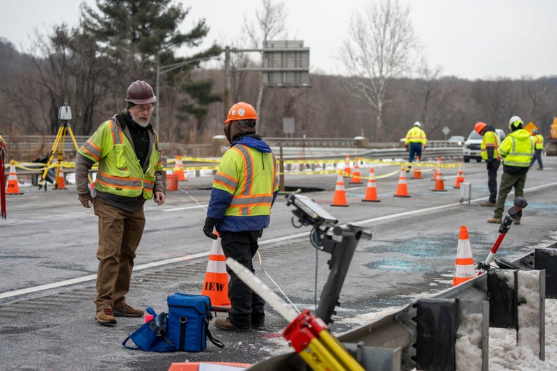 New Jersey Department of Transportation and construction workers repair a sinkhole that closes Interstate 80 eastbound near Exit 34 in Wharton on Tuesday, Feb. 11, 2025