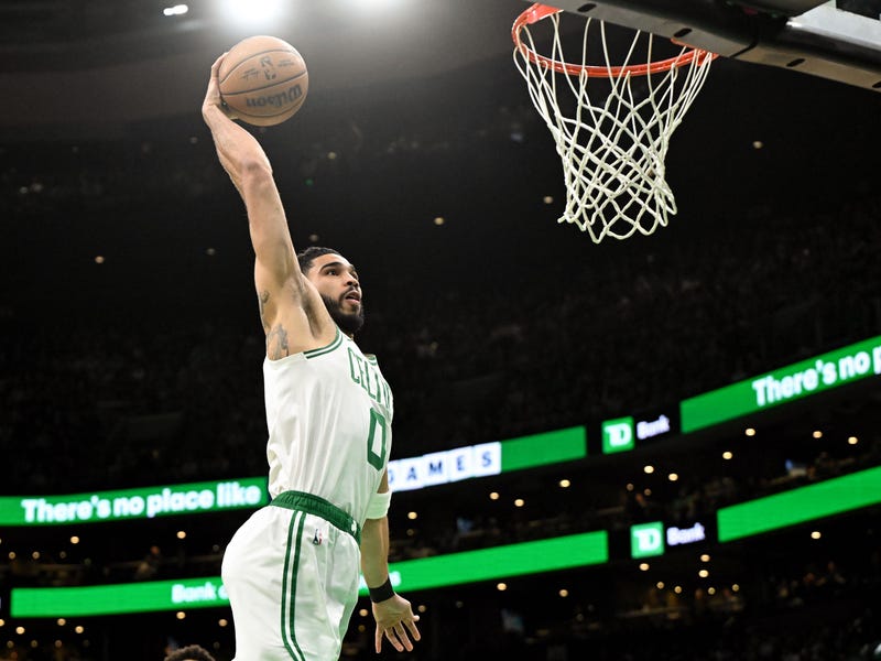 Boston Celtics forward Jayson Tatum (0) dunks and scores against the San Antonio Spurs during the first quarter at the TD Garden.