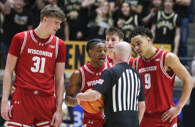 Wisconsin Badgers guard Kamari McGee (4) talks to an official after being ejected Saturday, Feb. 15, 2025, during the NCAA men’s basketball game against the Purdue Boilermakers at Mackey Arena in West Lafayette, Ind.