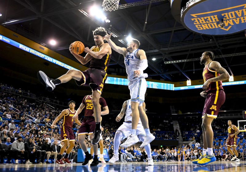 Golden Gophers forward Dawson Garcia (3) grabs a rebound in front of UCLA Bruins forward Tyler Bilodeau (34) during the first half at Pauley Pavilion presented by Wescom.