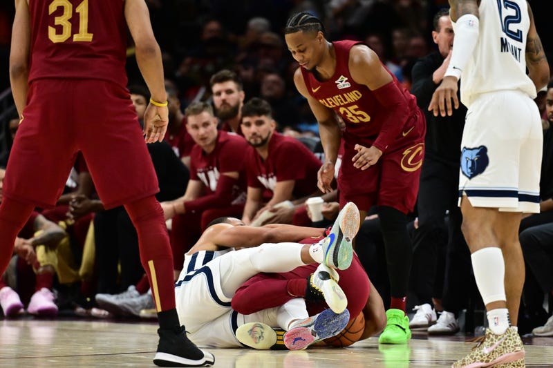 Cleveland Cavaliers guard Donovan Mitchell (45) and Memphis Grizzlies guard Desmond Bane (22) fight for the ball during the second half at Rocket Arena.
