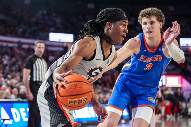 Feb 25, 2025; Athens, Georgia, USA; Georgia Bulldogs guard Silas Demary Jr. (5) dribbles against Florida Gators center Micah Handlogten (3) during the first half at Stegeman Coliseum. Mandatory Credit: Dale Zanine-Imagn Images