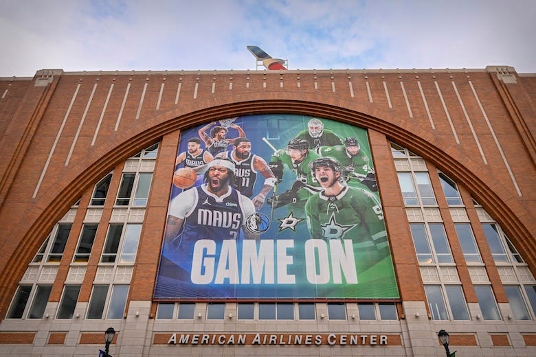 A view of the new banner for the NBA Dallas Mavericks and NHL Dallas Stars outside of the American Airlines Center featuring photos of Mavericks forward Anthony Davis and guard Kyrie Irving and center Dereck Lively II and guard Klay Thompson before the game between the Mavericks and the Sacramento Kings