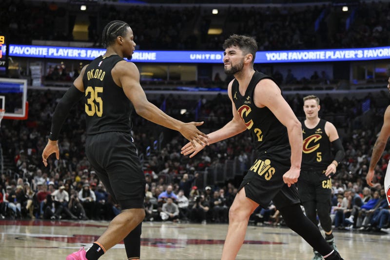Mar 4, 2025; Chicago, Illinois, USA; Cleveland Cavaliers guard Ty Jerome (2) reacts with forward Isaac Okoro (35) after he scores against the Chicago Bulls during the second half at United Center. 