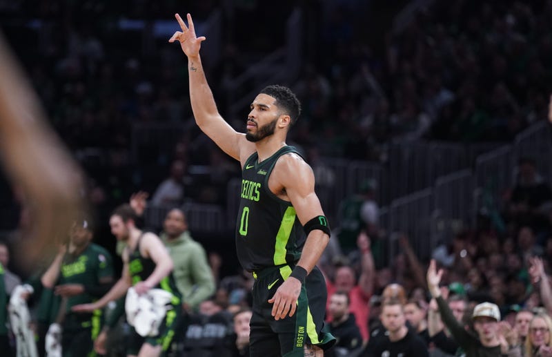 Boston, Massachusetts, USA; Boston Celtics forward Jayson Tatum (0) reacts after his three point basket against the Philadelphia 76ers in the second half at TD Garden.
