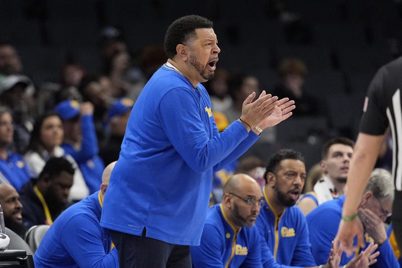 Jeff Capel on sidelines clapping