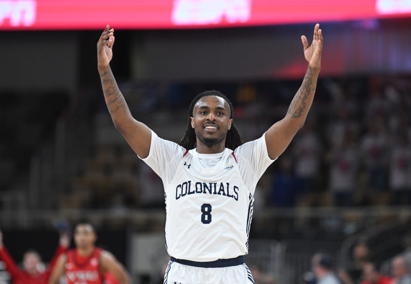 Kam Woods celebrating with arms in the air