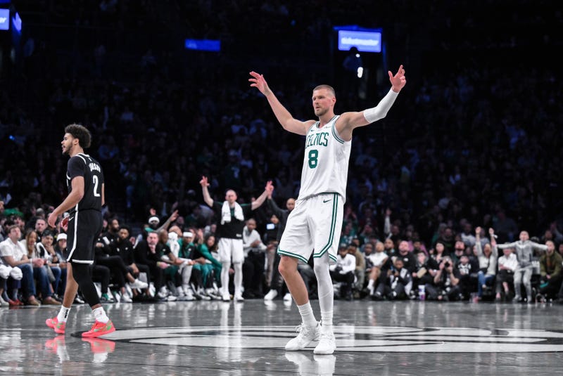 Boston Celtics center Kristaps Porzingis (8) reacts after a three point basket during the second half against the Brooklyn Nets at Barclays Center.