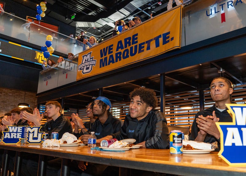 Marquette Golden Eagles players watch the NCAA selection show during the Marquette University men's basketball team NCAA tournament selection show party at MECCA Sports Bar and Grill on Sunday March 16, 2025 in Milwaukee, Wis.
