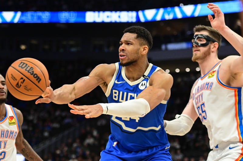 Mar 16, 2025; Milwaukee, Wisconsin, USA; Milwaukee Bucks forward Giannis Antetokounmpo (34) passes the ball away from Oklahoma City Thunder center Isaiah Hartenstein (55) in the fourth quarter at Fiserv Forum. Mandatory Credit: Benny Sieu-Imagn Images