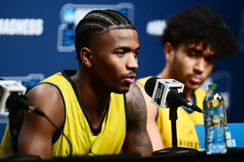 Mar 20, 2025; Cleveland, OH, USA; Marquette Golden Eagles guard Kam Jones (1) talks to the media before practice at Rocket Arena. Mandatory Credit: Ken Blaze-Imagn Images