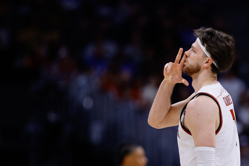Mar 20, 2025; Denver, CO, USA; Wisconsin Badgers forward Carter Gilmore (7) celebrates after a basket against the Montana Grizzlies during the second half in the first round of the NCAA Tournament at Ball Arena. Mandatory Credit: Isaiah J. Downing-Imagn Images