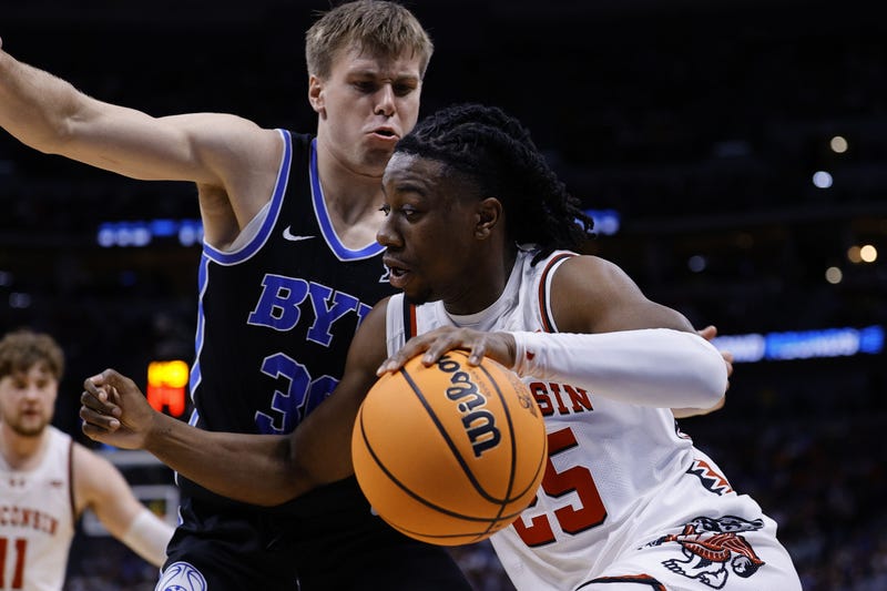 Mar 22, 2025; Denver, CO, USA; Wisconsin Badgers guard John Blackwell (25) dribbles the ball against the Brigham Young Cougars during the first half in the second round of the NCAA Tournament at Ball Arena. Mandatory Credit: Isaiah J. Downing-Imagn Images