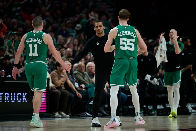 Boston Celtics head coach Joe Mazzulla greets players during a time out during the second half against the Portland Trail Blazers at Moda Center.