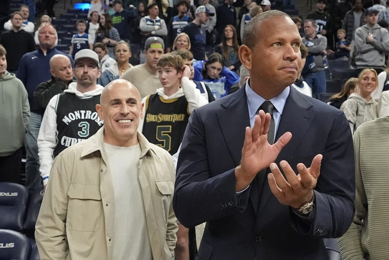 Minnesota Timberwolves minority owners - now majority owners - Marc Lore and Alex Rodriguez celebrate the team's win over the Phoenix Suns at Target Center. 