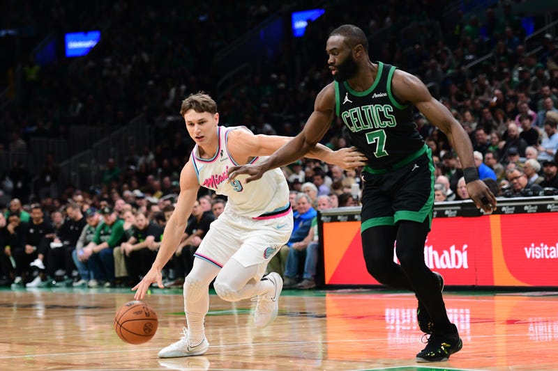 Miami Heat guard Pelle Larsson (9) dribbles against Boston Celtics guard Jaylen Brown (7) during the first half at TD Garden.