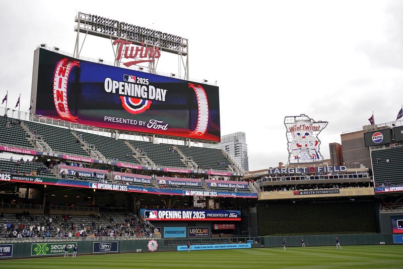 The scoreboard displays the Opening Day logo for Minnesota Twins Home Opener before a game against the Houston Astros at Target Field.