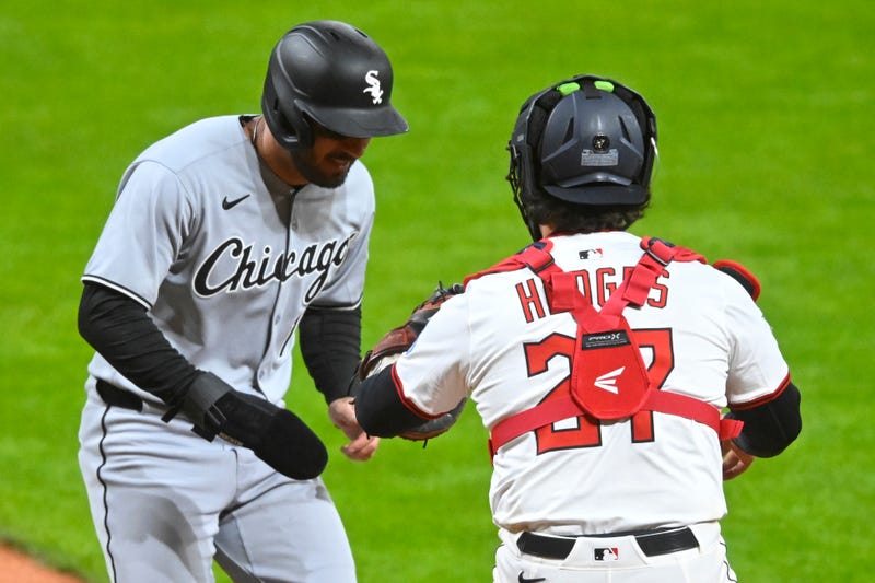 Cleveland Guardians catcher Austin Hedges (27) tags out Chicago White Sox right fielder Mike Tauchman (18) for the final out of the game in the ninth inning at Progressive Field. 