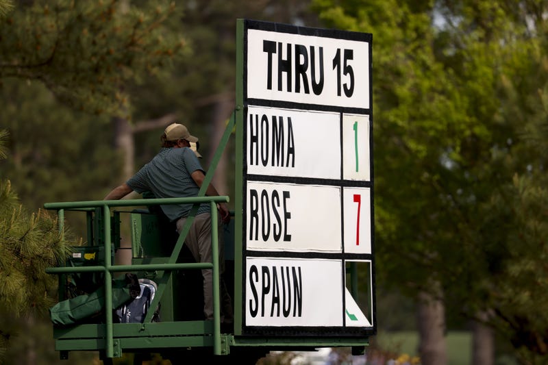 Apr 10, 2025; Augusta, Georgia, USA; Workers adjust a thru board during the first round of the Masters Tournament. Mandatory Credit: Peter Casey-Imagn Images