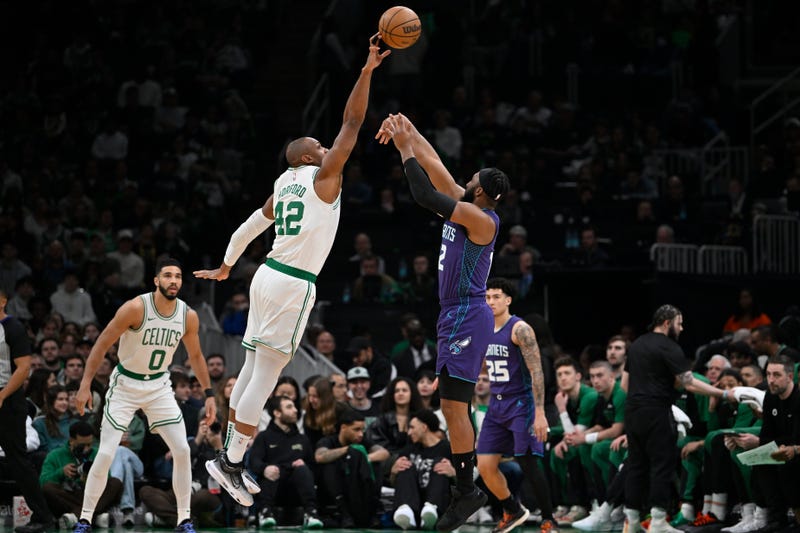 Boston Celtics center Al Horford (42) blocks a shot by Charlotte Hornets forward Josh Okogie (12) during the first half at TD Garden.