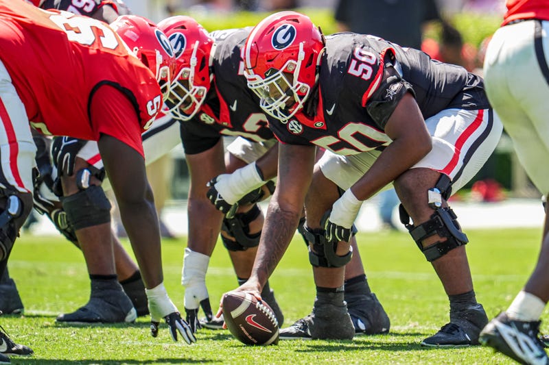  Georgia Bulldogs offensive lineman Cortez Smith (50) over the ball during the Georgia Spring game at Sanford Stadium.
