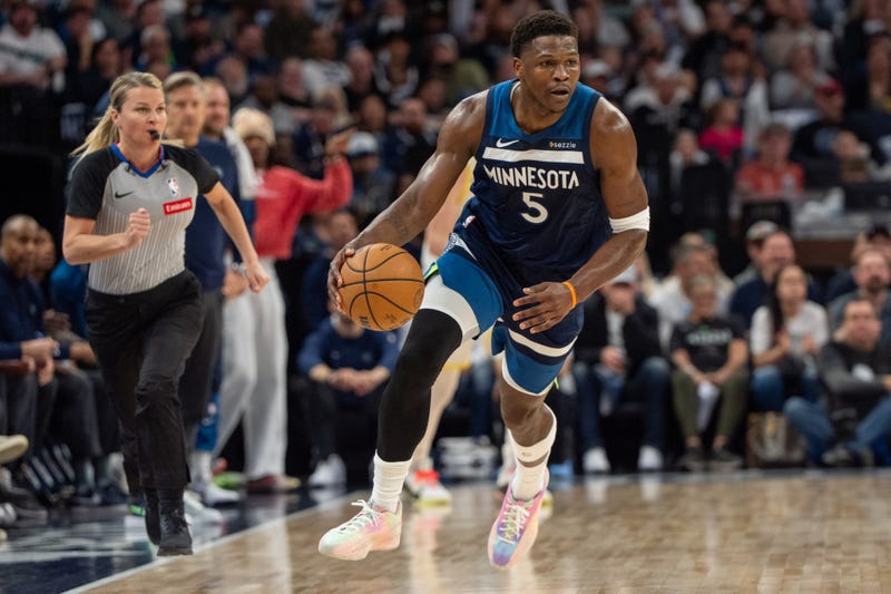 Timberwolves guard Anthony Edwards (5) brings the ball up court in the first quarter at Target Center against Utah Sunday. The Wolves win clinched a playoff berth and avoids the play-in tournament.