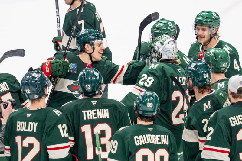 Minnesota Wild center Joel Eriksson Ek (14) congratulates Minnesota Wild goaltender Marc-Andre Fleury (29) after defeating the Anaheim Ducks in overtime at Xcel Energy Center. 