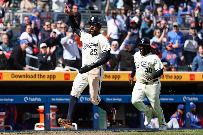 Minnesota Twins center fielder Byron Buxton (25) celebrates after scoring the game winning run on a hit by first baseman Ty France (13) during the tenth inning against the New York Mets at Target Field.