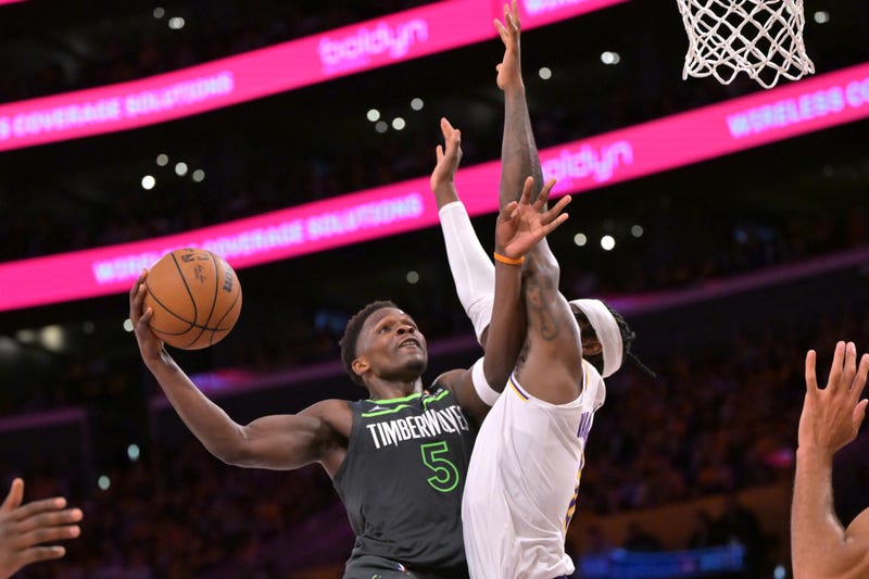 Minnesota Timberwolves guard Anthony Edwards (5) is defended by Los Angeles Lakers forward Jarred Vanderbilt (2) in the second half at Crypto.com Arena.