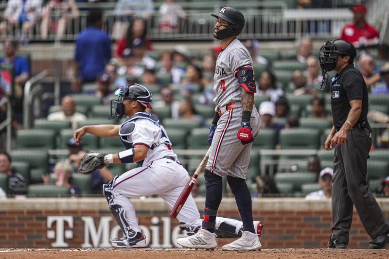 Minnesota Twins shortstop Carlos Correa (4) reacts after being called out on strikes against the Atlanta Braves during the seventh inning at Truist Park.