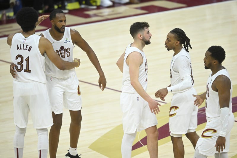 Apr 20, 2025; Cleveland, Ohio, USA; The Cleveland Cavaliers gather near center court in the fourth quarter during a win over the Miami Heat at Rocket Arena.