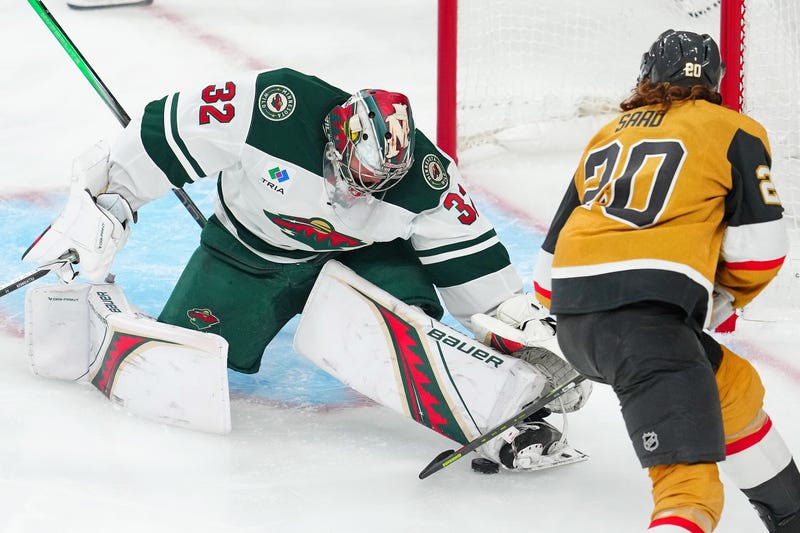 Minnesota Wild goaltender Filip Gustavsson (32) makes a save against Vegas Golden Knights left wing Brandon Saad (20) during the third period of game one of the first round of the 2025 Stanley Cup Playoffs at T-Mobile Arena.