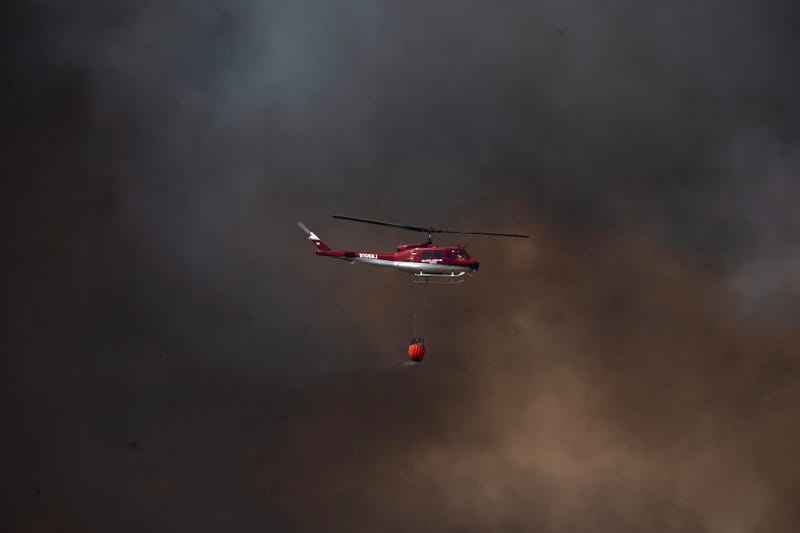 A wildfire burns in the Pinelands Forest northwest of Wells Mills Park along Route 532 near Jones Road in Ocean Township on April 22, 2025