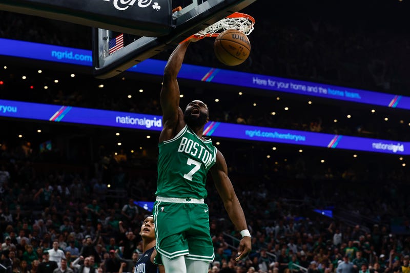 Boston, Massachusetts, USA; Boston Celtics guard Jaylen Brown (7) dunks against the Orlando Magic during the second half of game two of the first round of the 2024 NBA Playoffs at TD Garden.