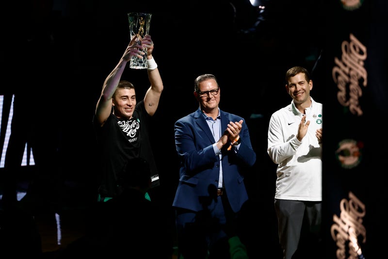Boston Celtics guard Payton Pritchard (11) holds up the 2025 NBA Sixth Man Award as Celtics president of basketball operations Brad Stevens, right, applauds before game two of the first round of the 2024 NBA Playoffs between the Boston Celtics and the Orlando Magic at TD Garden. Mandatory Credit: Winslow Townson-Imagn Images