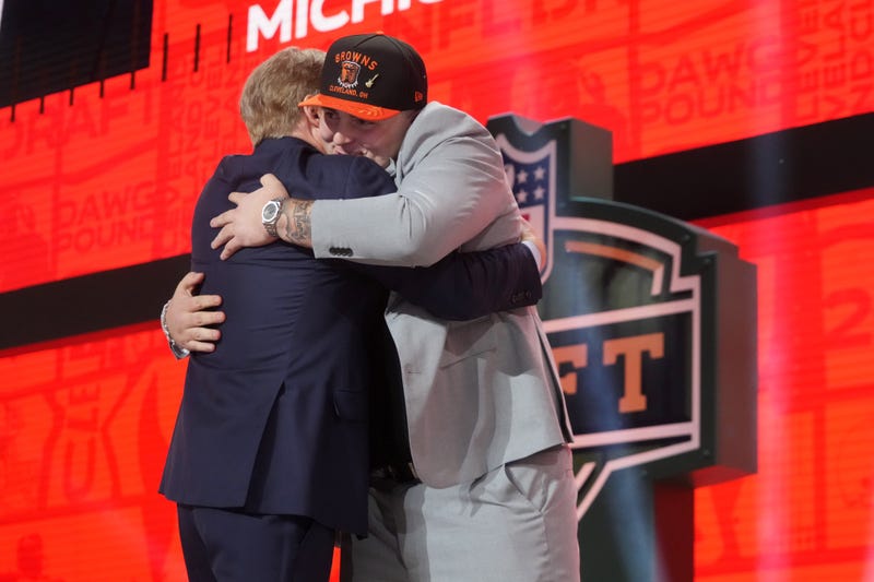 Apr 24, 2025; Green Bay, WI, USA; NFL commissioner Roger Goodell with Michigan Wolverines defensive lineman Mason Graham after he is selected by the Cleveland Browns as the number five pick in the first round of the 2025 NFL Draft at Lambeau Field.