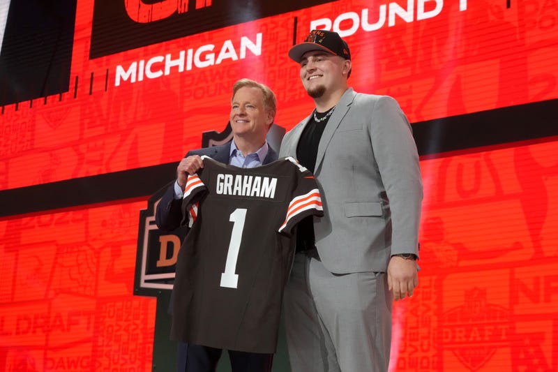 Apr 24, 2025; Green Bay, WI, USA; NFL commissioner Roger Goodell with Michigan Wolverines defensive lineman Mason Graham after he is selected by the Cleveland Browns as the number five pick in the first round of the 2025 NFL Draft at Lambeau Field. 