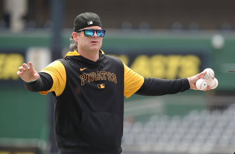 Pirates hitting coach Matt Hague working a drill