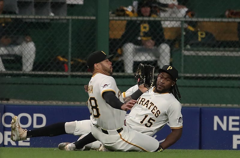 Tommy Pham sliding catch while Oneil Cruz slides as well