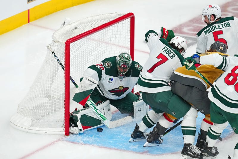 Minnesota Wild goaltender Marc-Andre Fleury (29) makes a save against the Vegas Golden Knights behind Minnesota Wild defenseman Brock Faber (7) during an overtime period of game five of the first round of the 2025 Stanley Cup Playoffs at T-Mobile Arena.